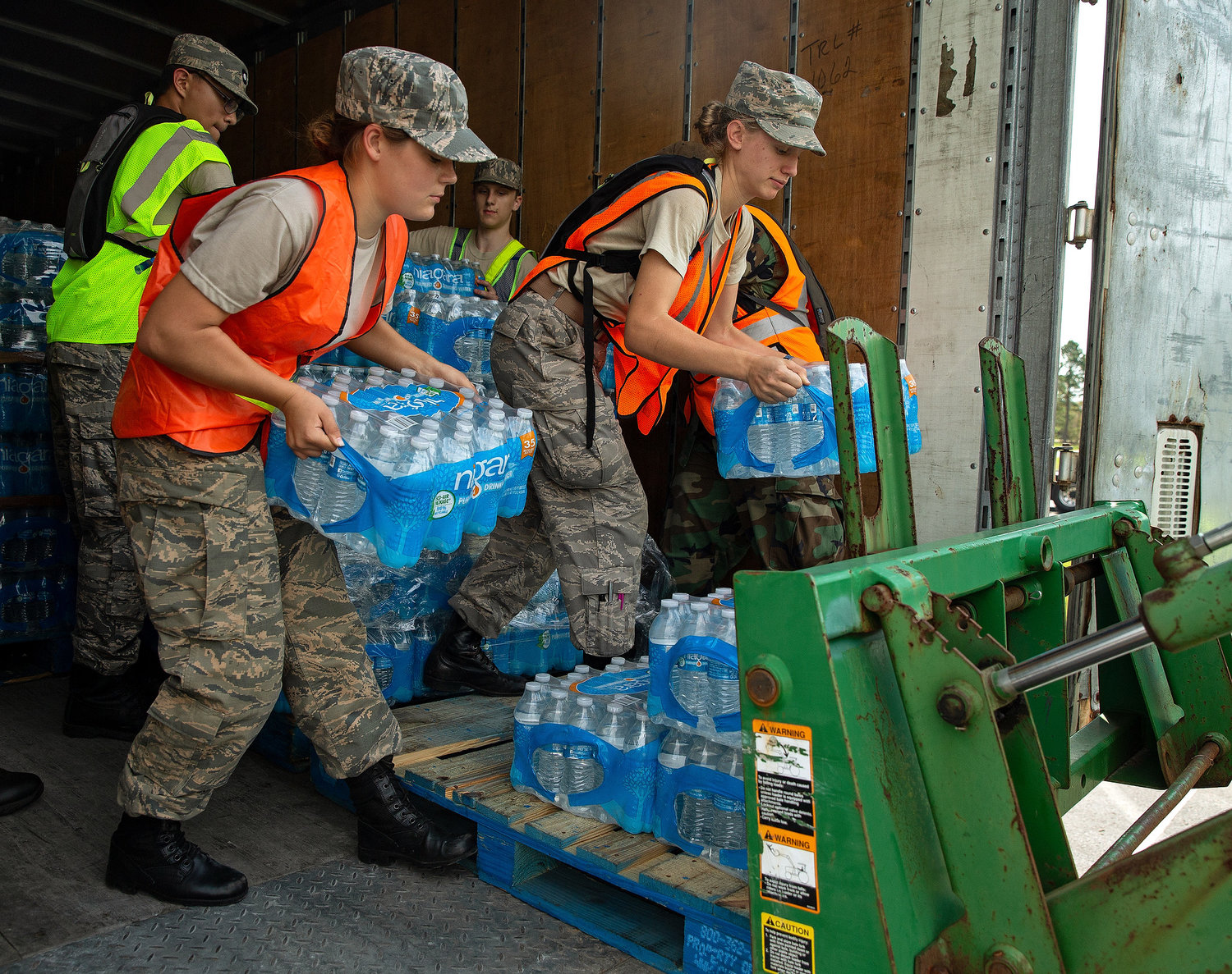 Cadets help victims of Hurricane Florence in 2018. Here, Cadet Chief Master Sgt. Moriah Hersch, from MER-MD-065, left, and Cadet Airman Karmen Jones from MER-MD-065 unload water from a trailer outside of Wilmington, NC.